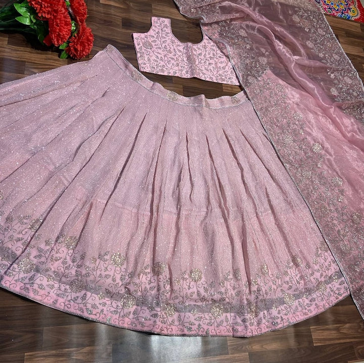 Sabyasachi Designer peach-pink Lehenga Choli with intricate Shimmer Dori work