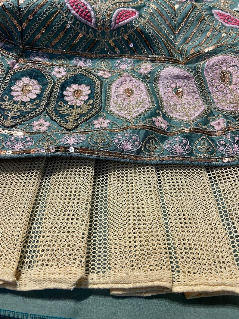 Beautiful red and gold designer lehenga choli with intricate embroidery details